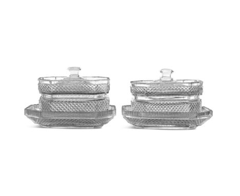 A PAIR OF IRISH OCTAGONAL WAISTED BUTTER DISHES, COVERS AND STANDS C.1830 WATERFORD, the stepped lids with seal handles, shar
