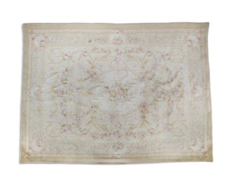 AN AUBUSSON PATTERN WOOL RUG, the cream ground decorated with a central floral medallion and with all-over foliate scrollwork