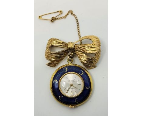 A Blita blue cloisonne enamel fob watch suspended from a yellow metal bow brooch. (enamel as found)