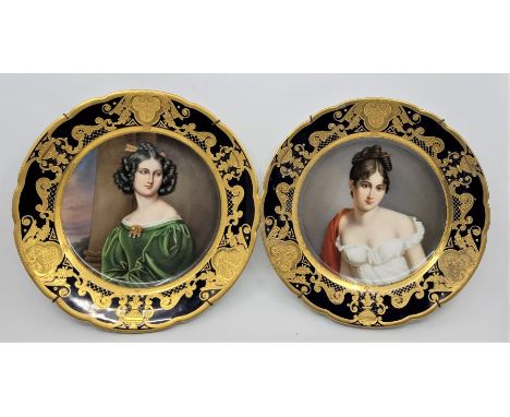 A pair of Dresden porcelain portrait cabinet plates, with rich blue and gilt border, both having hand painted half length por