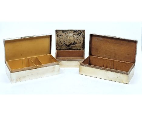 Three silver cigarette boxes, to include: a large silver cigarette box with engine turned lid, by Northern Goldsmiths Co, Lon