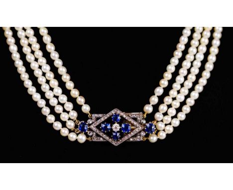 An exquisite Art Deco four-row natural saltwater pearl choker with diamond and sapphire clasp. The four strands with slightly