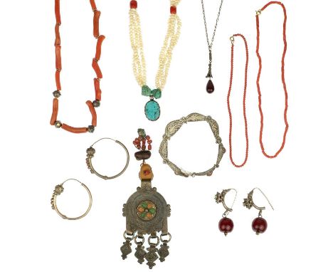 A selection of ethnic coral costume jewellery.  A selection of coral jewellery includes a coral stick necklace, small bead br