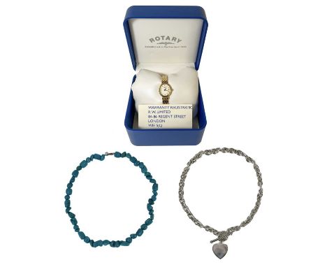 A silver necklace, a turquoise bead necklace and a Rotary quartz wristwatch. The silver chain with T-bar clasp and heart pend