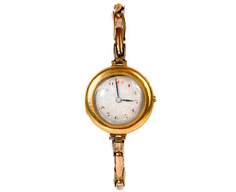 A 1920's 18ct cased lady's manual wind wristwatch, with 15ct expanding bracelet. With 16mm silvered dial, 15 jewel movement, 