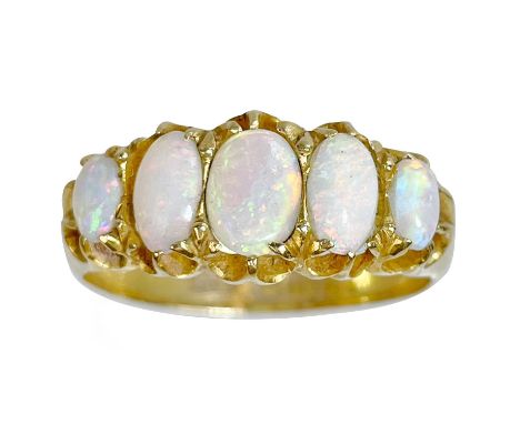 A Victorian 18ct white opal set five-stone ring. Each oval opal displaying muliple colours, the largest 6.2 x 4.2mm, in a car