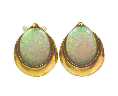 A pair of 14ct white crystal opal set earrings. The oval opals displaying multiple colours measuring 9 x 8mm, length 12mm, st