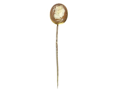 A Victorian gold mounted shell cameo shell stick pin. Carved with the head of Leda, length 8.5cm, 3.7g.