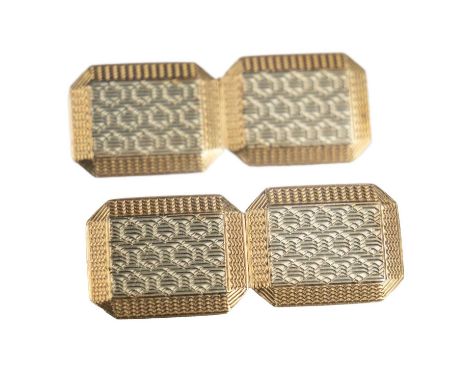 A pair of 9ct white and yellow gold engine turned cufflinks. Hallmarked Birmingham 1925, 8.7g, within a Robert Douglas retail