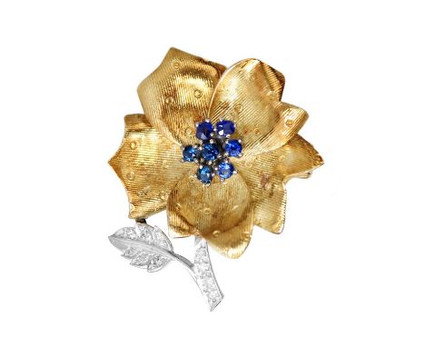 A Ben Rosenfeld for Asprey 18ct white and yellow gold diamond and sapphire set flower brooch. The stamen set with seven round