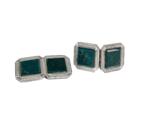 A pair of 9ct white gold bloodstone set cufflinks. The square heads with engine turned decoration, stamped 9.ct, 8.3g.