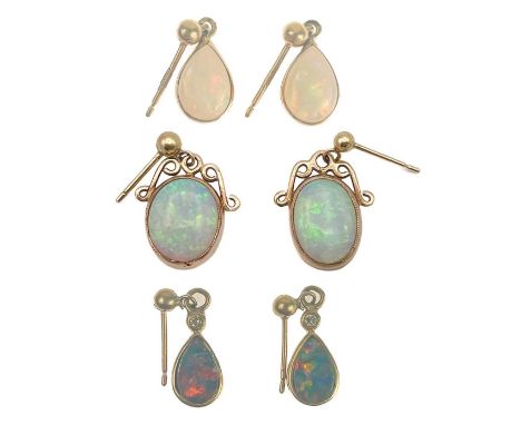 Three pairs of 9ct mounted opal pendant earrings. To include a pair of black doublet opal earrings of pear shape, each collet