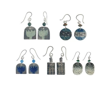 Five pairs of Nancy Pickard drop earrings. A selection of earrings with hammered metal, blue enamel and blue beads. All stamp