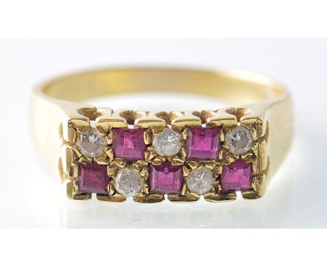 An 18ct gold / 750 London hallmarked ruby and diamond pave set ring.&nbsp; The ruby stones being square cut interspersed with