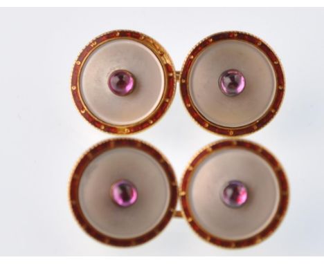 A pair of French early 20th century gold, ruby and mother of pearl enamel round gentleman's cuff links. Each with a central r