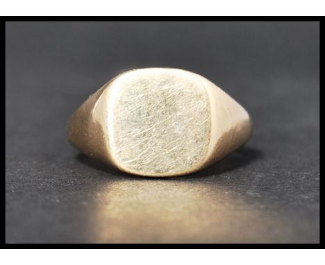 A hallmarked 9ct gold signet ring. Hallmarked Birmingham. Weight 6.9g. Size R.