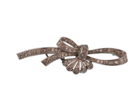 &nbsp;An early 20th century 18ct gold and diamond brooch. The brooch in the form of a bow and spray, being set with single cu