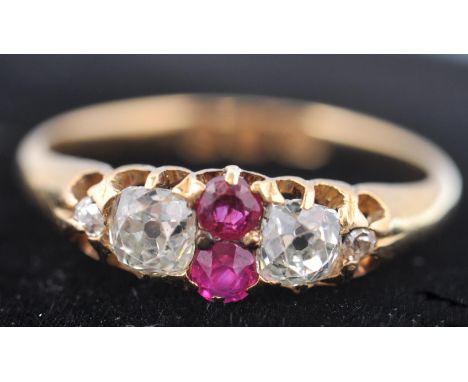 A Victorian hallmarked 18ct gold ruby and diamond ring dated 1893 London. The ring having 2 old cut European diamonds of appr