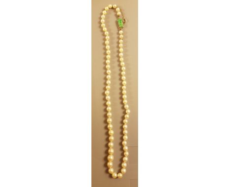 An early 20th century cultured pearl and jadeite jade necklace. The necklace strung with good cultured pearls having a fine c