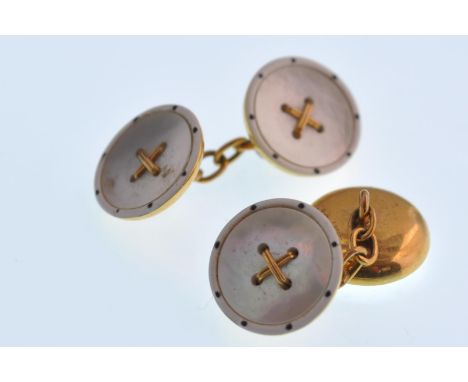 A pair of early 20th century gold mother of pearl and enamel roundel gentleman's cuff links. Each with a cross within a mothe