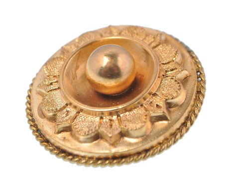 A Victorian gold roundel from brooch adorned with central ball finial having step rose banded border. Pin Verso with c-clasp.