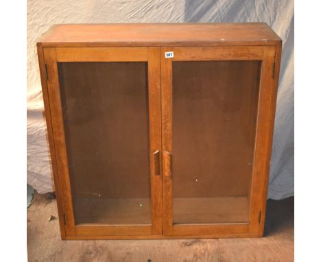 A vintage glass display cabinet 36" x 36" x 12"
