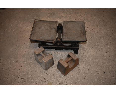 A pair of coal scales by W.H.WEST Norwich with two 56lbs weights