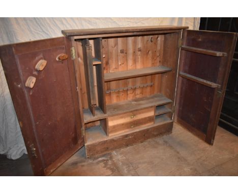 An antique pine tool cupboard