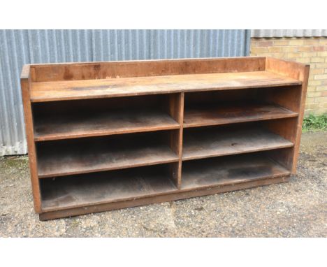 A vintage wooden shop fitting with shelves