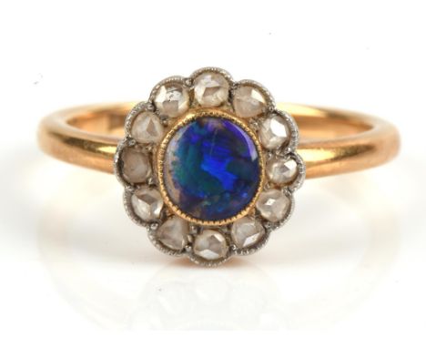 Black opal and rose cut diamond cluster ring, opal measures 5.8 x 5.4mm, mount stamped 18 ct, ring size NCondition Report:  1