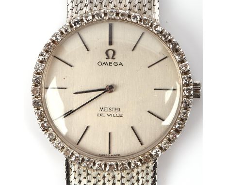 Omega a ladies white gold and diamond cocktail watch,the bezel set with 30 diamonds surmounting a signed dial with baton hour