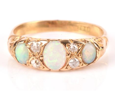 Antique opal and old cut diamond seven stone ring, mount stamped 18 ct, ring size K 1/2.Condition Report:  Weight 3.2 grams.