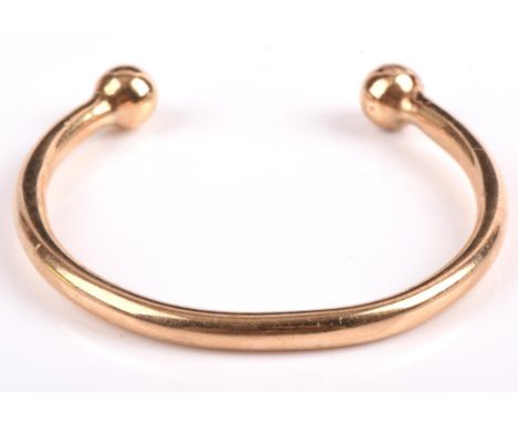 Torque bangle in testing as 9 ct gold, inner diameter approximately 6cmCondition Report:  Weight 30.1 grams.