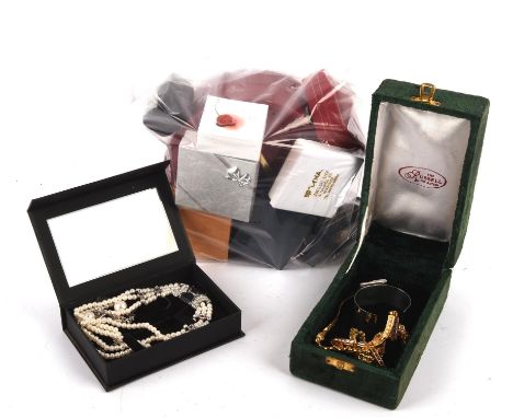 Group of costume jewellery, including two Swarovski necklaces, bead necklaces, clip on earrings, eight brooches, including an