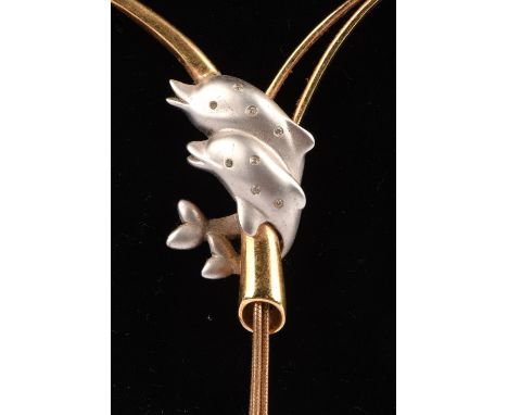 Dolphin necklace and bangle, the necklace designed as two white gold dolphins, set with small diamonds, with a yellow metal t