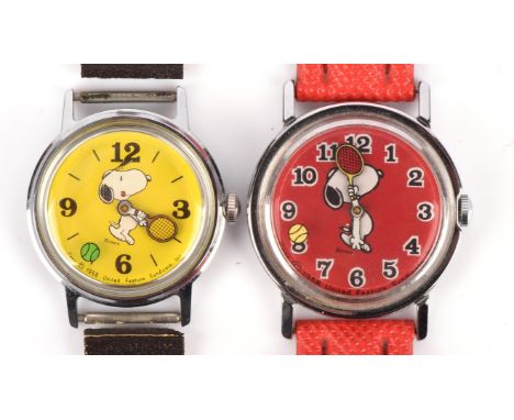 A Timex Marlin Snoopy wristwatch, the yellow dial with tennis racket minute hand and ball seconds hand, fitted with manual wi