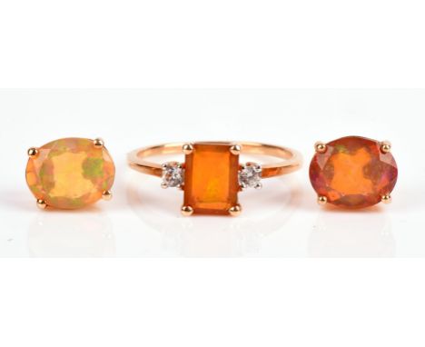 A Welo opal and white zircon three stone ring, size P, together with a pair of earrings in 9 ct goldCondition Report:  Gross 