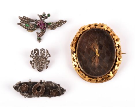 Selection of mainly antique silver brooches, including an enamel and gem set phoenix, diamond set monogram, and floral engrav