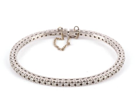 Diamond bangle, set with approximately 59 round brilliant cut diamonds, weighing an estimated total of 3.00 carat, with a box
