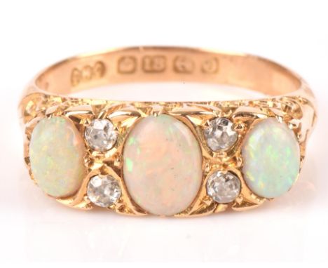 Opal and old cut diamond ring in 18 ct yellow gold, hallmarked Birmingham 1913, maker's stamp C.M.C, ring size M 1/2.Conditio