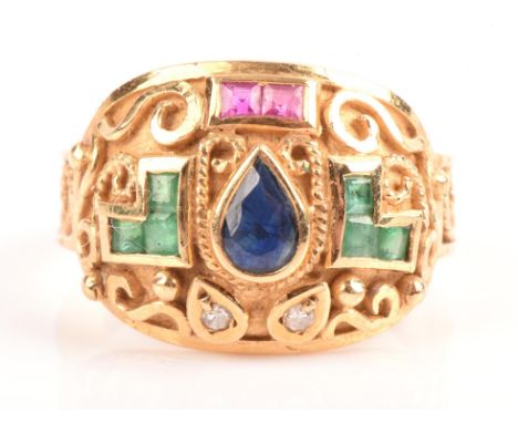 Gem set ring, domed shape, set with a pear cut sapphire, square calibre cut emeralds and rubies and single cut diamonds, surr