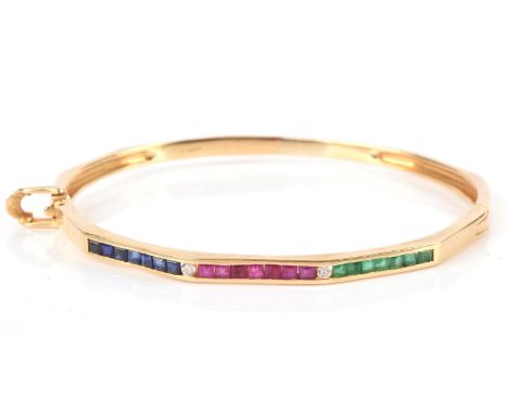 Emerald, ruby sapphire and diamond hinged bangle, decagon shaped, with a section set with square cut sapphires, square cut ru