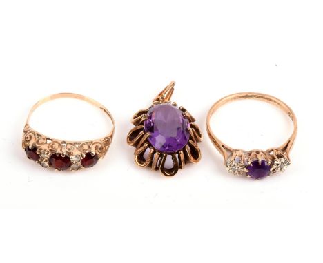 A garnet and paste ring, size P, an amethyst and diamond ring, size S and an amethyst pendant, all in 9 ctCondition Report:  