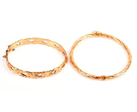 Two bangles, including a 9 ct hinged twist motif bangle, inside diameter 64mm x 58mm, together with a rolled gold openwork ba