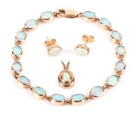 A set of opal jewellery including a bracelet in hallmarked 9 ct yellow gold, length 18.8cm, an opal pendant in hallmarked 9 c