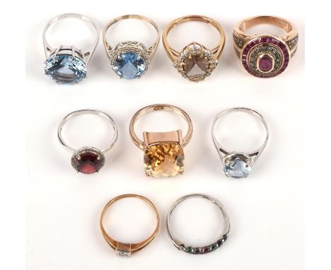 Nine gemstone and diamond set rings, consisting of a single stone brilliant cut diamond ring in yellow and white metal tested