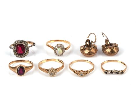 A group of six rings, including a diamond and opal ring, mount in testing as 18 ct, a sapphire and diamond wishbone ring hall