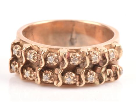 Two row diamond ring, set with thirteen round brilliant cut diamonds, mounted in tested 9 ct, ring size TCondition Report:  G