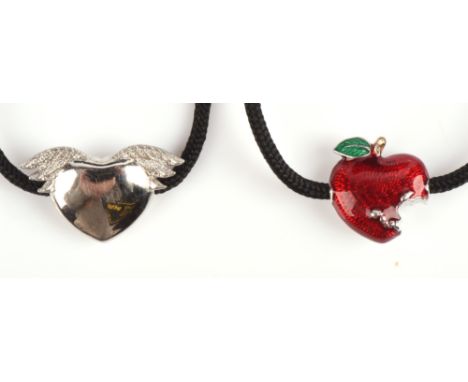 Two Theo Fennell silver bracelets on black cord, one with a winged heart, one with an enamel apple.Condition Report:  Gross w