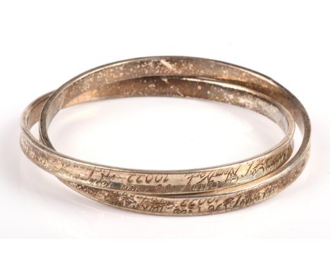 A Tiffany & Co. sterling silver double bangle, stamped "2003 Tiffany & Co. 925", with "Tiffany & Co. New York" engraved.Condi